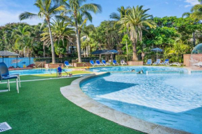 2-Bed Family Haven with Pools BBQ & Playgrounds